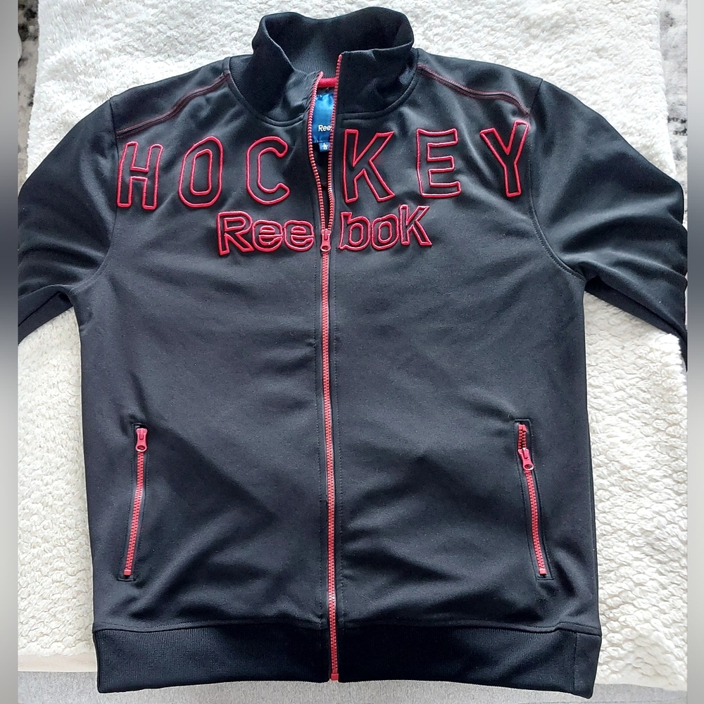 Reebok Black Jacket with Red Accents.